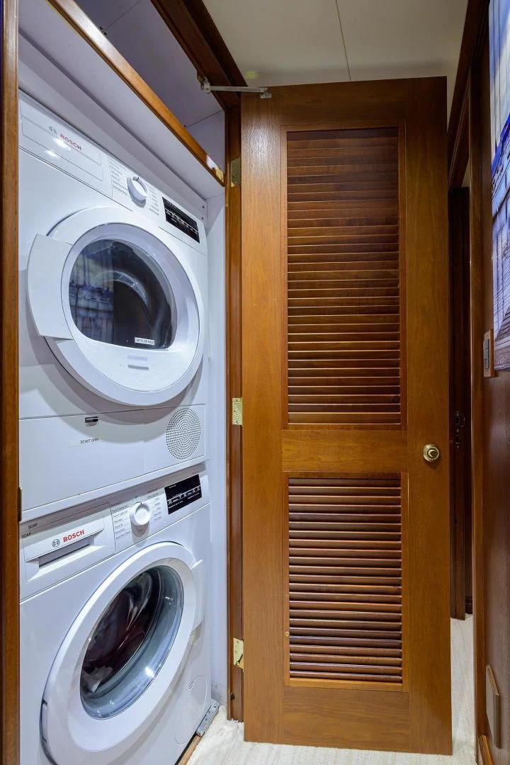 a closet with a washing machine aboard CHECKERS Yacht for Sale
