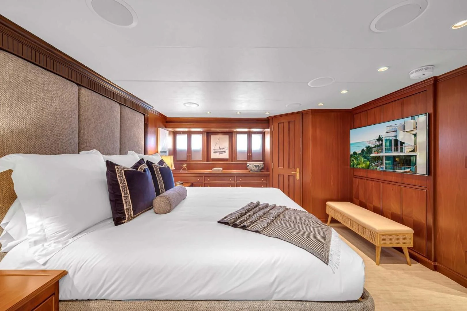 a large bed in a room aboard CHECKERS Yacht for Sale