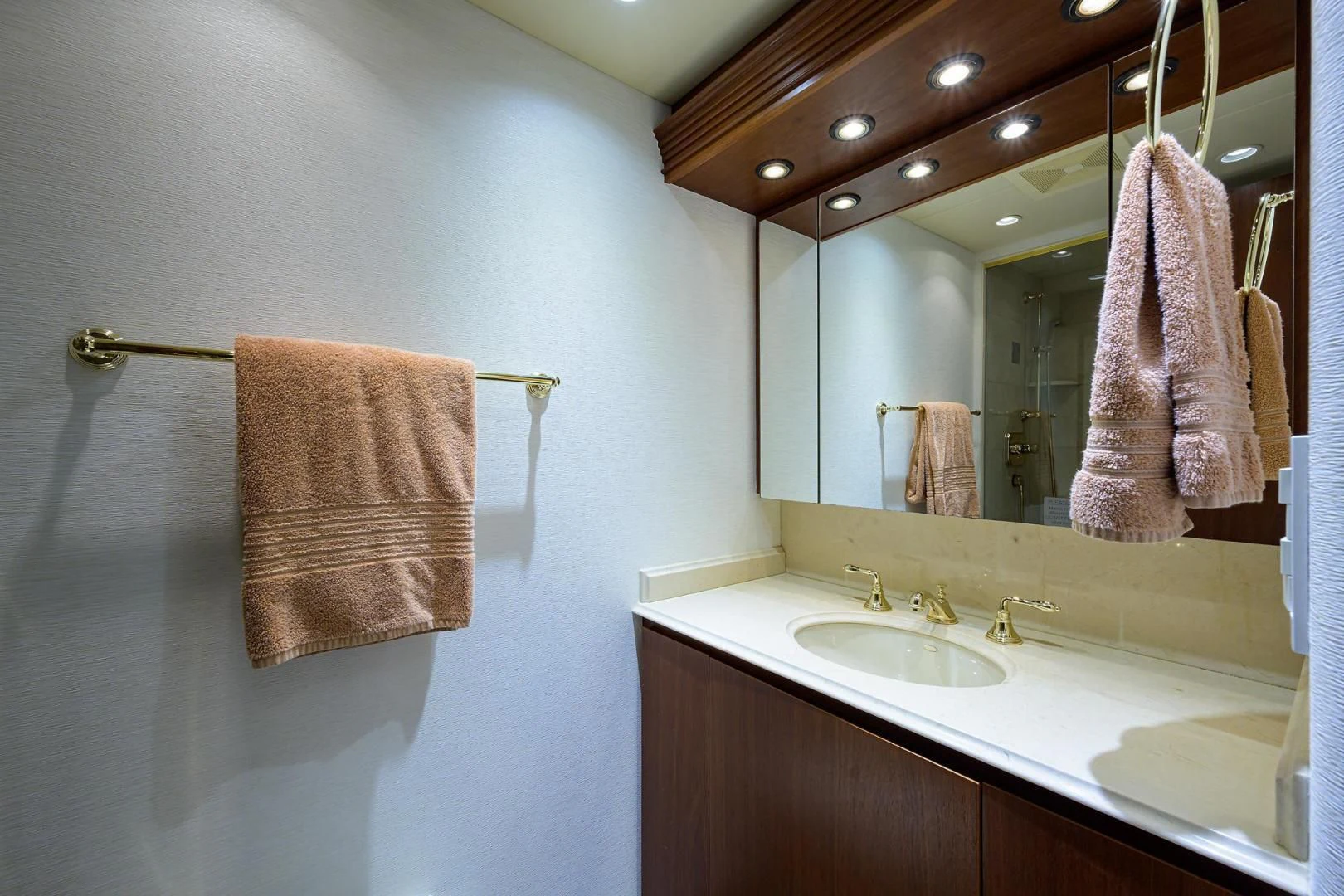 a bathroom with a large mirror aboard CHECKERS Yacht for Sale