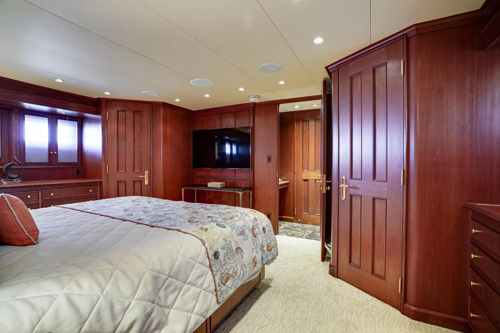 a bedroom with a bed and a television aboard CHECKERS Yacht for Sale