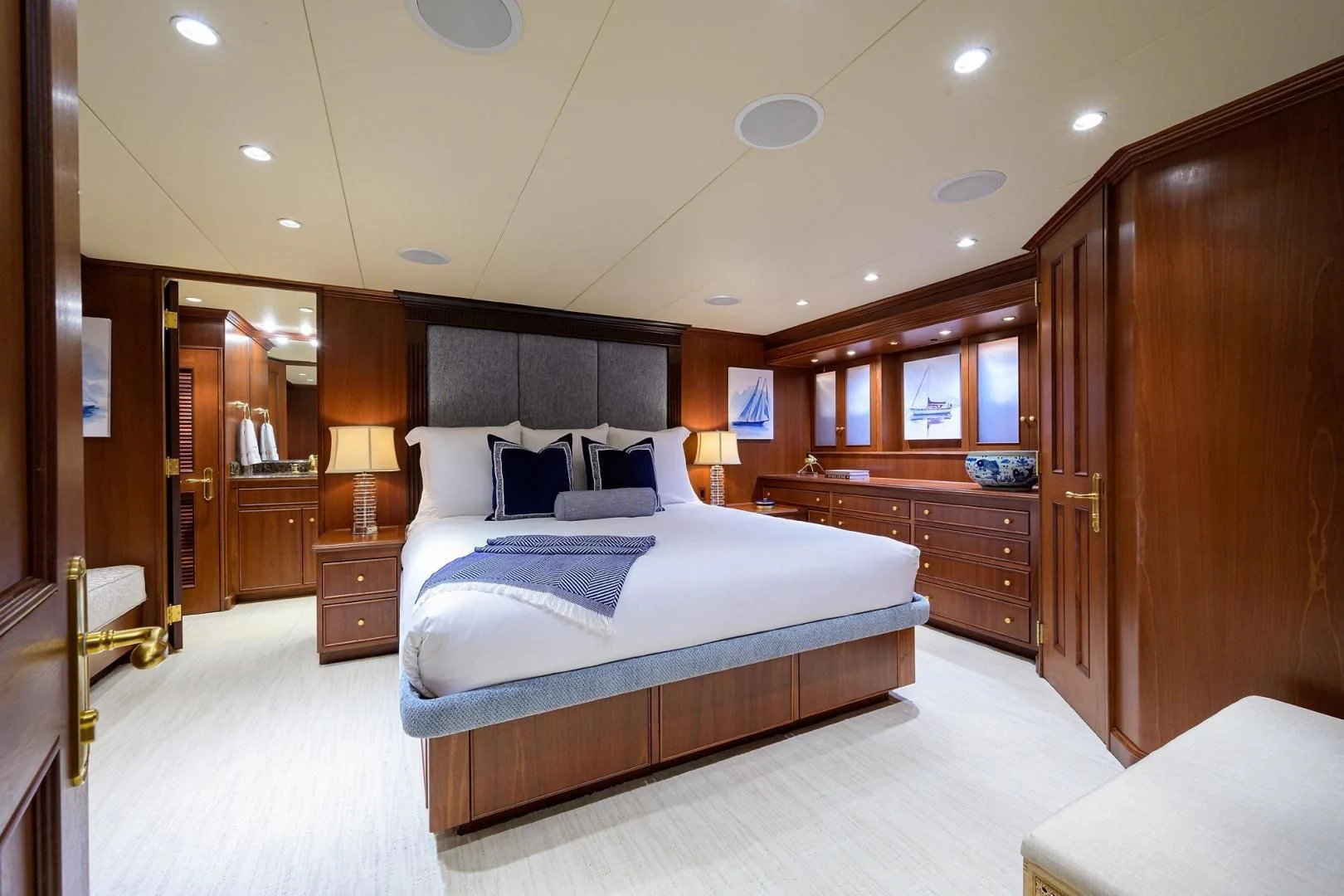 a bedroom with a bed and a closet aboard CHECKERS Yacht for Sale