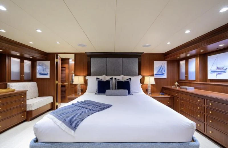 a large bed in a hotel room aboard CHECKERS Yacht for Sale
