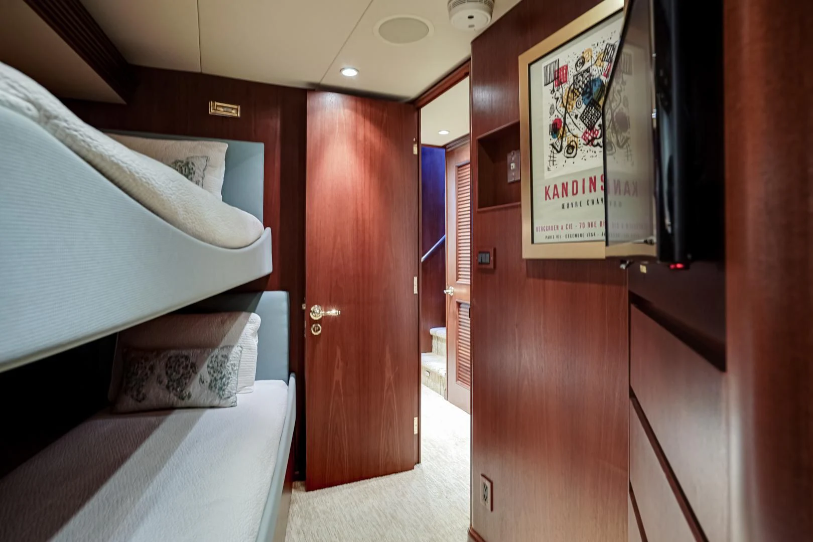 a room with a bed and a closet aboard CHECKERS Yacht for Sale