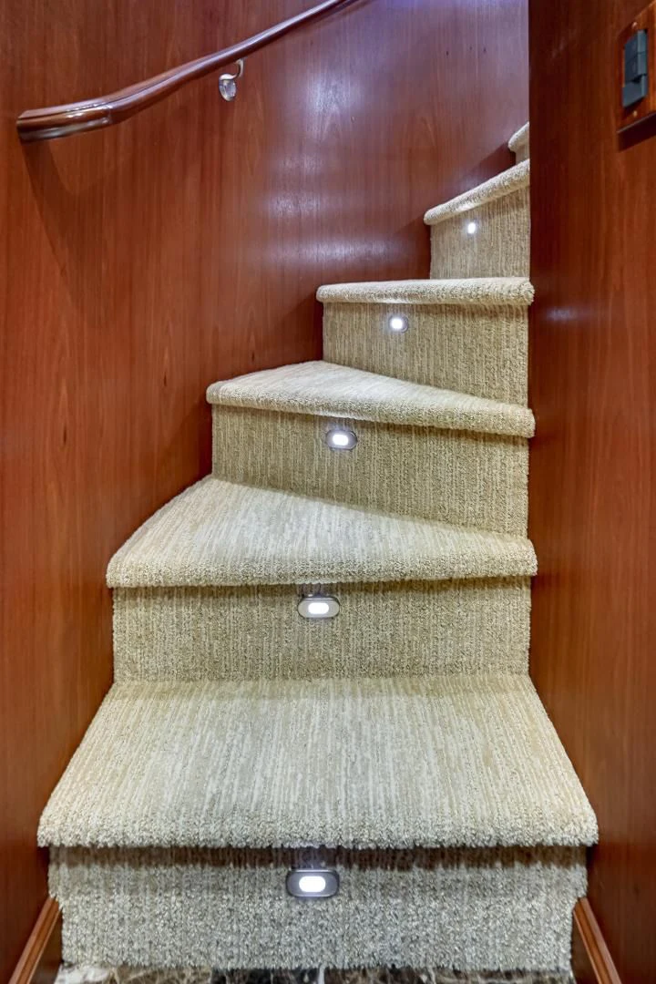 a stack of boxes on a wooden surface aboard CHECKERS Yacht for Sale