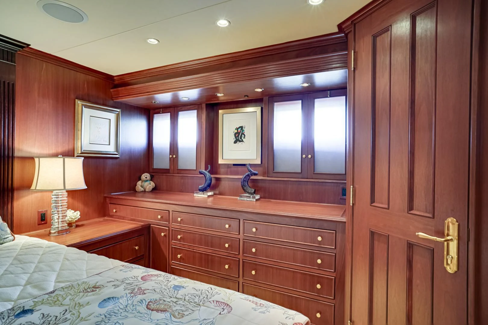 a bedroom with a dresser and a mirror aboard CHECKERS Yacht for Sale