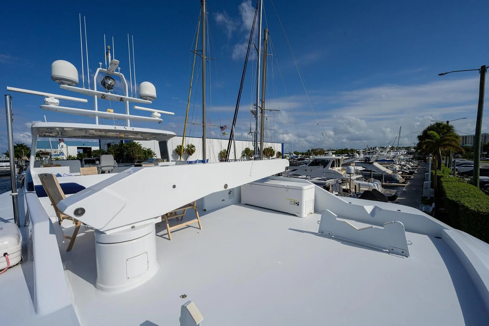 a white boat on a dock aboard CHECKERS Yacht for Sale