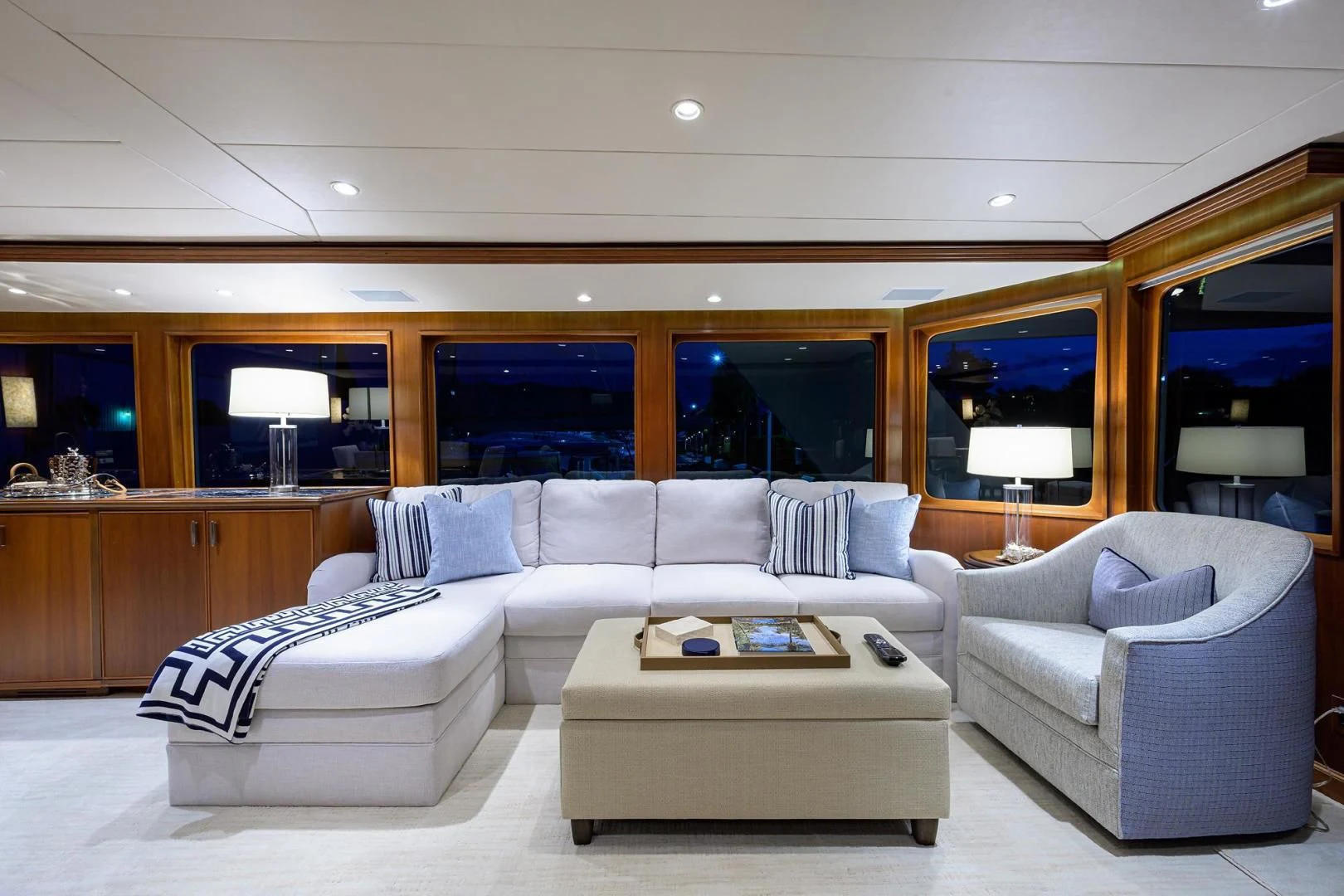 a living room with a couch and a table aboard CHECKERS Yacht for Sale