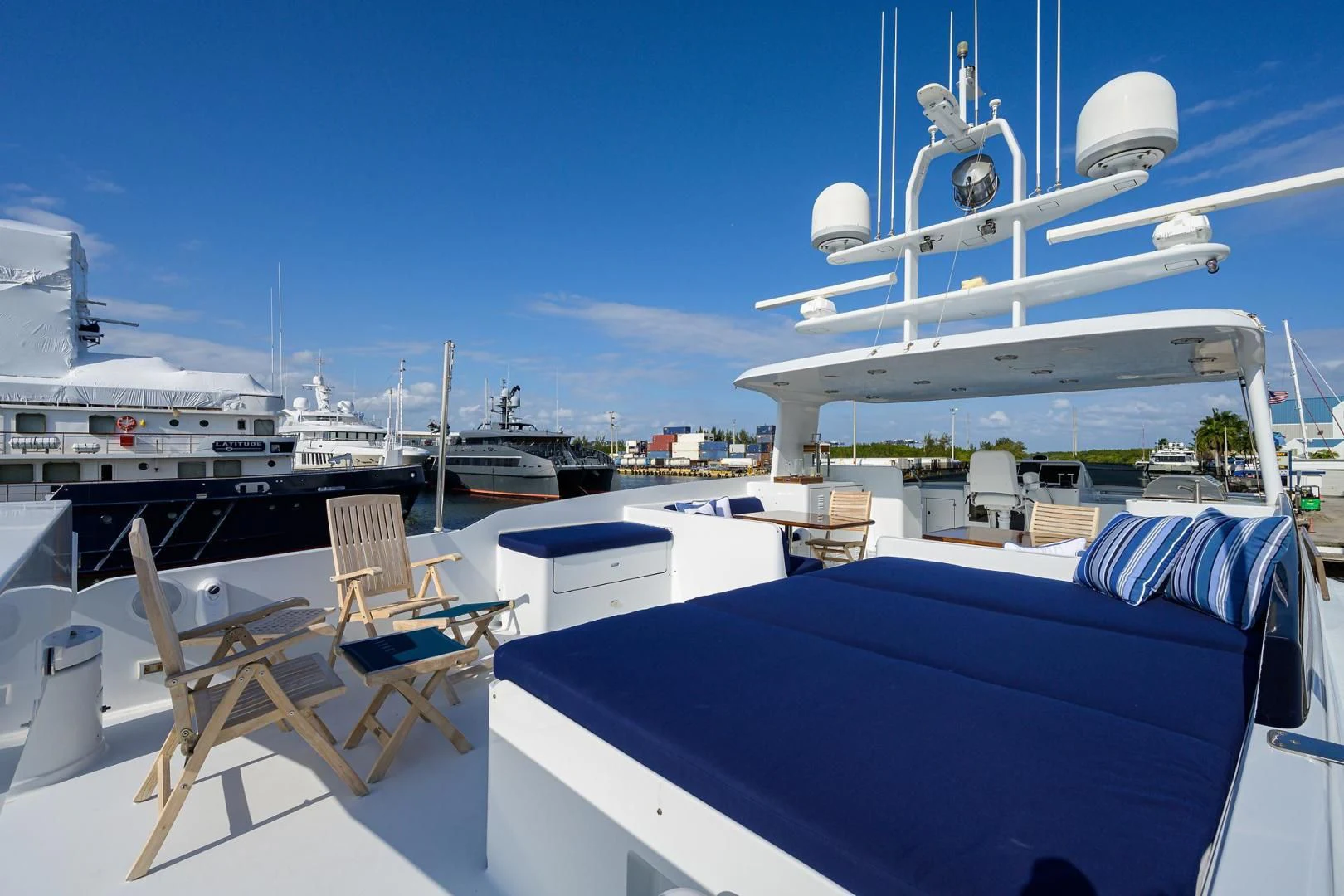 a boat docked at a pier aboard CHECKERS Yacht for Sale