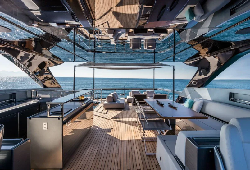 a deck with a deck and chairs aboard RIVA 102/19 Yacht for Sale