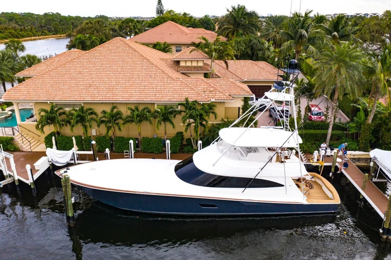 a boat docked at a pier aboard WHY WOULDN'T WE Yacht for Sale