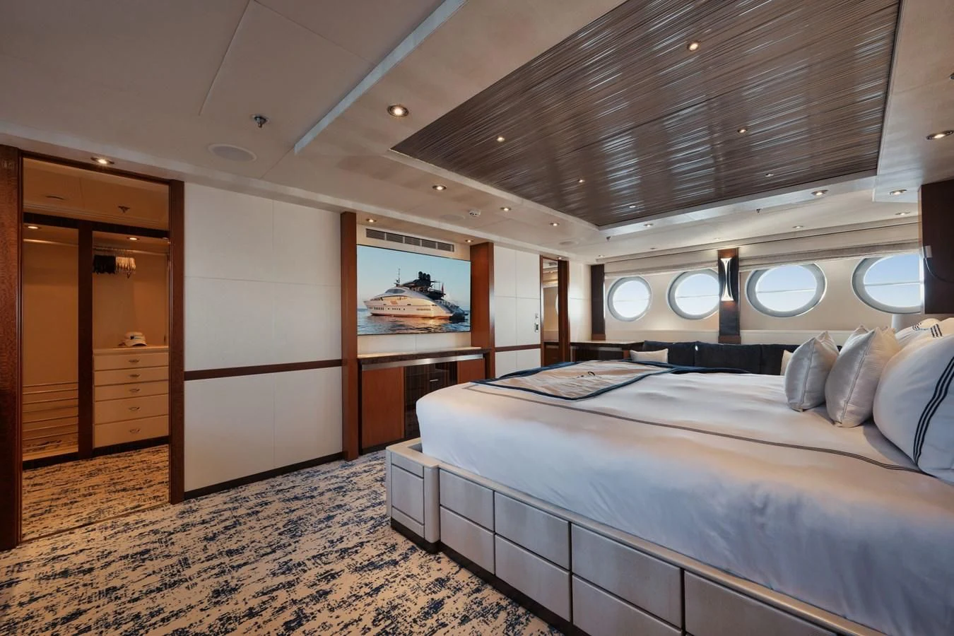 a room with a bed and a mirror aboard AQUANOVA Yacht for Sale