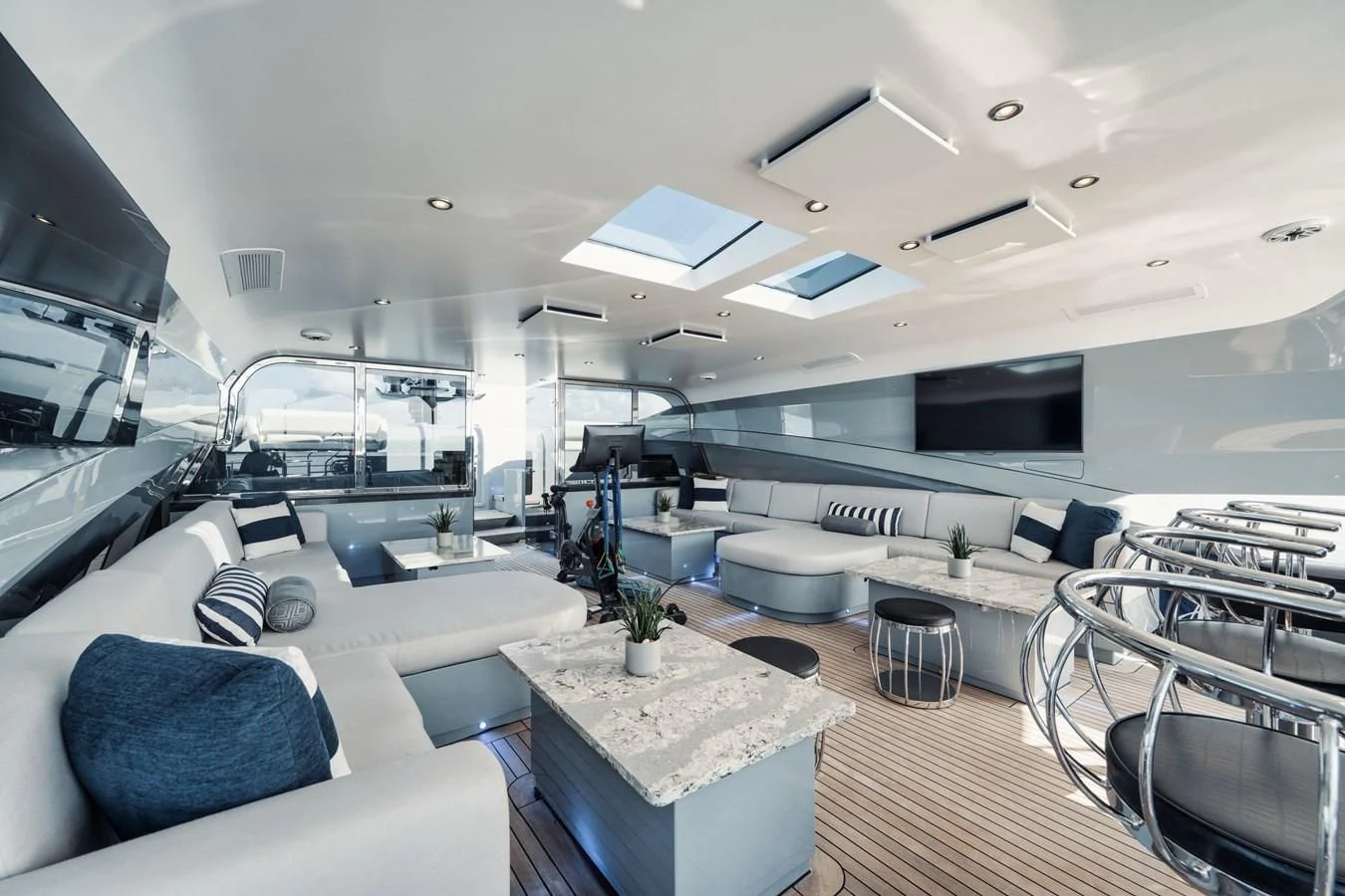 inside of a room with a large window and a table with chairs aboard AQUANOVA Yacht for Sale