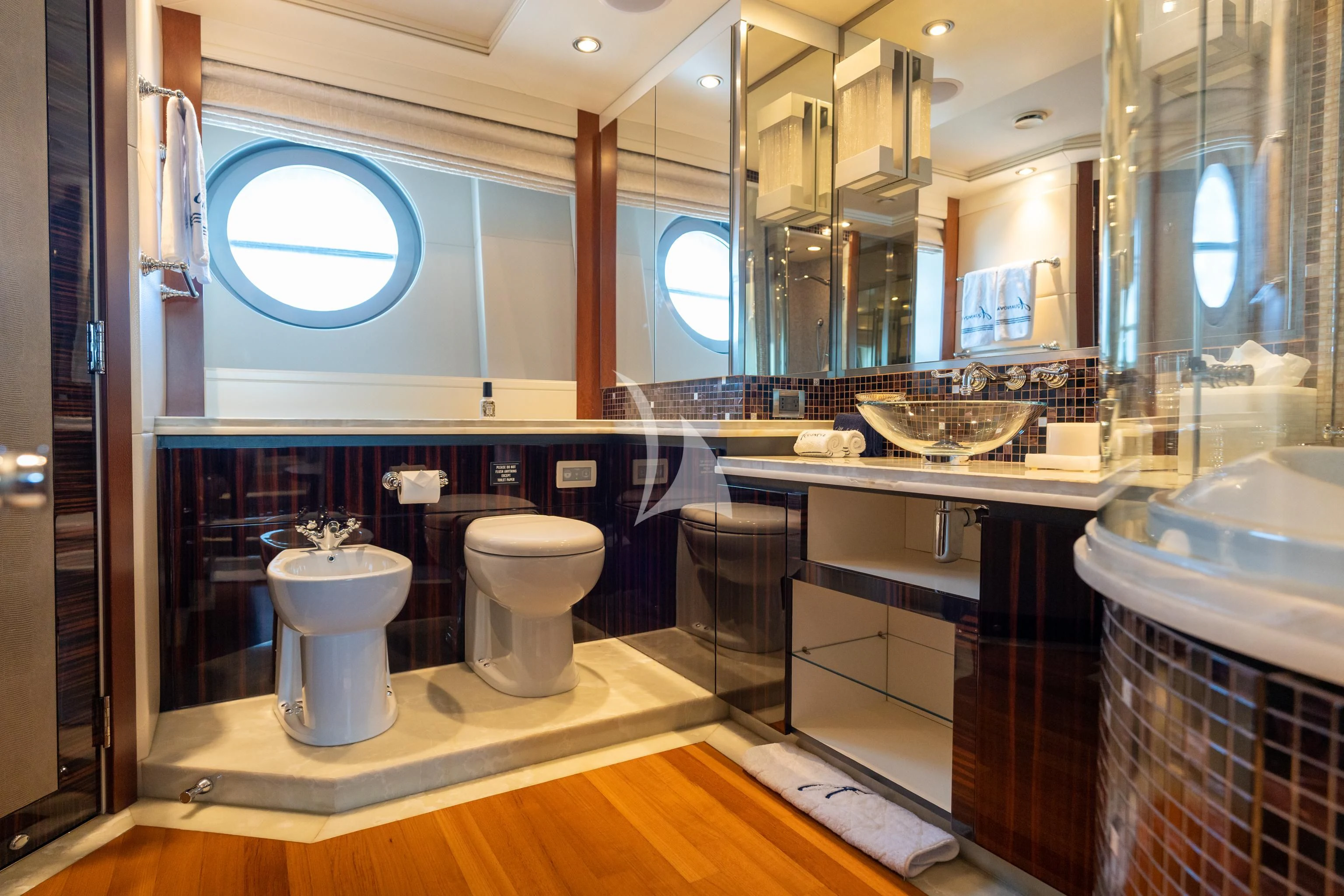 a bathroom with a large mirror aboard AQUANOVA Yacht for Sale