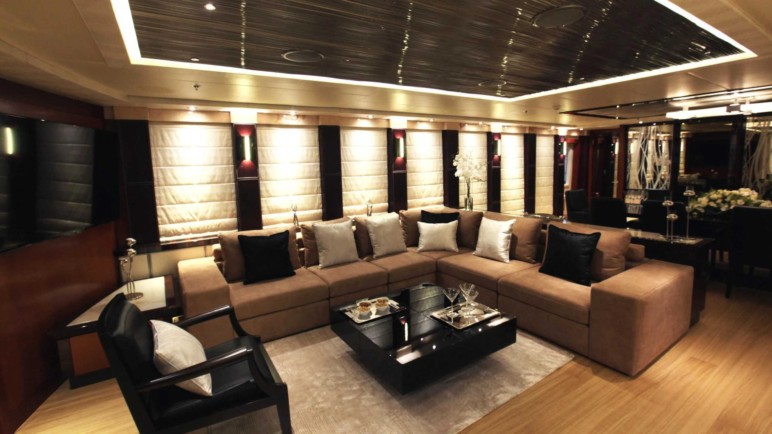a living room with a large window aboard AQUANOVA Yacht for Sale