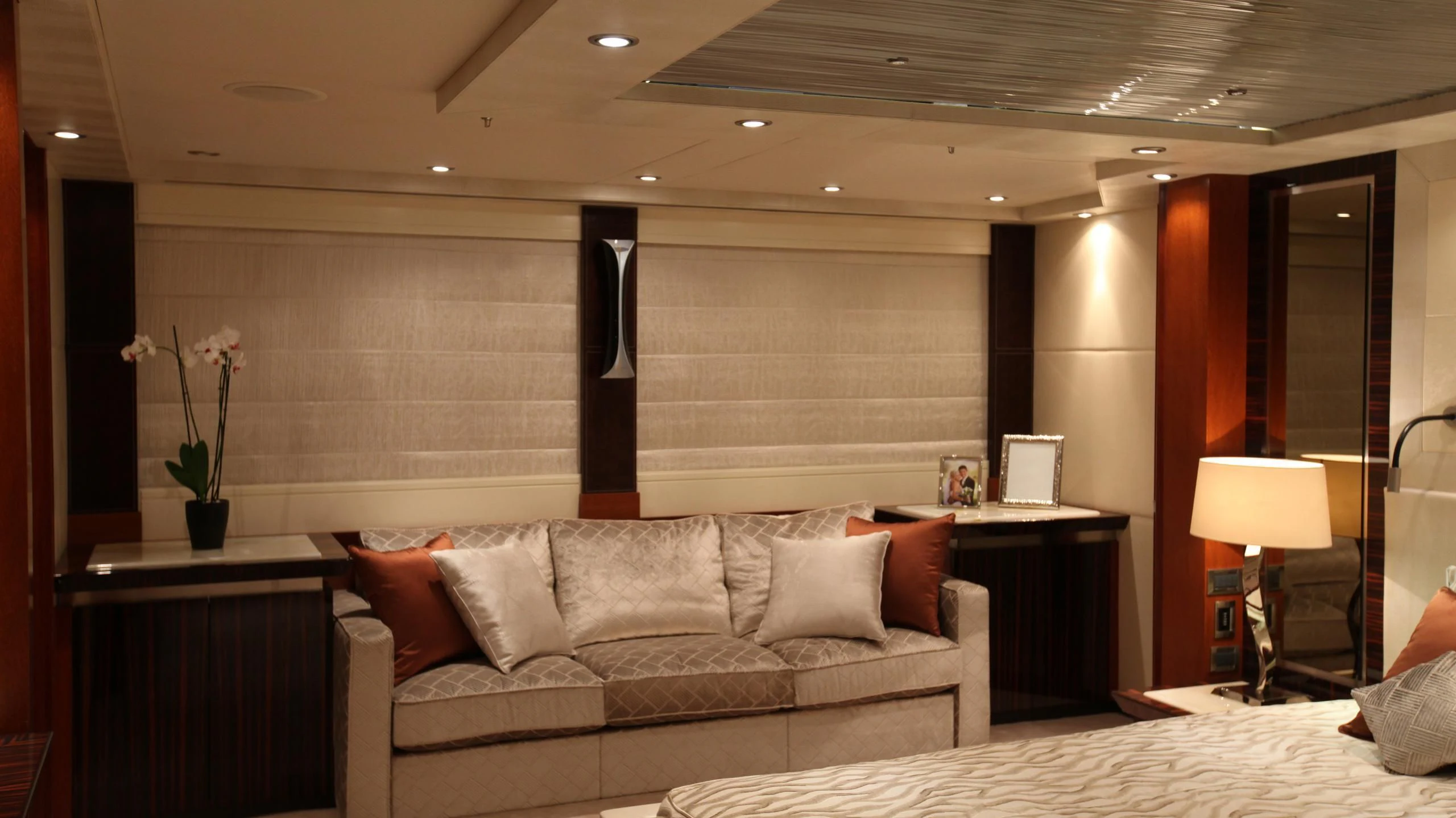 a living room with a couch and a lamp aboard AQUANOVA Yacht for Sale