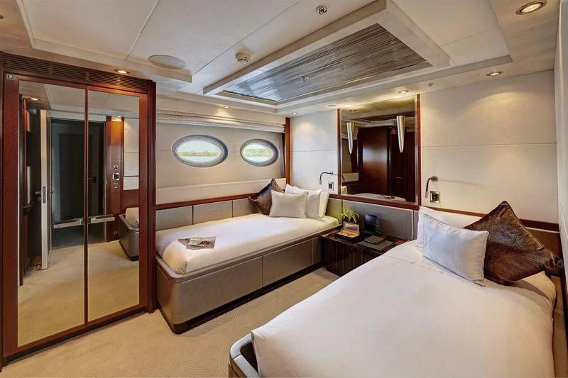 a room with a bed and a mirror aboard AQUANOVA Yacht for Sale
