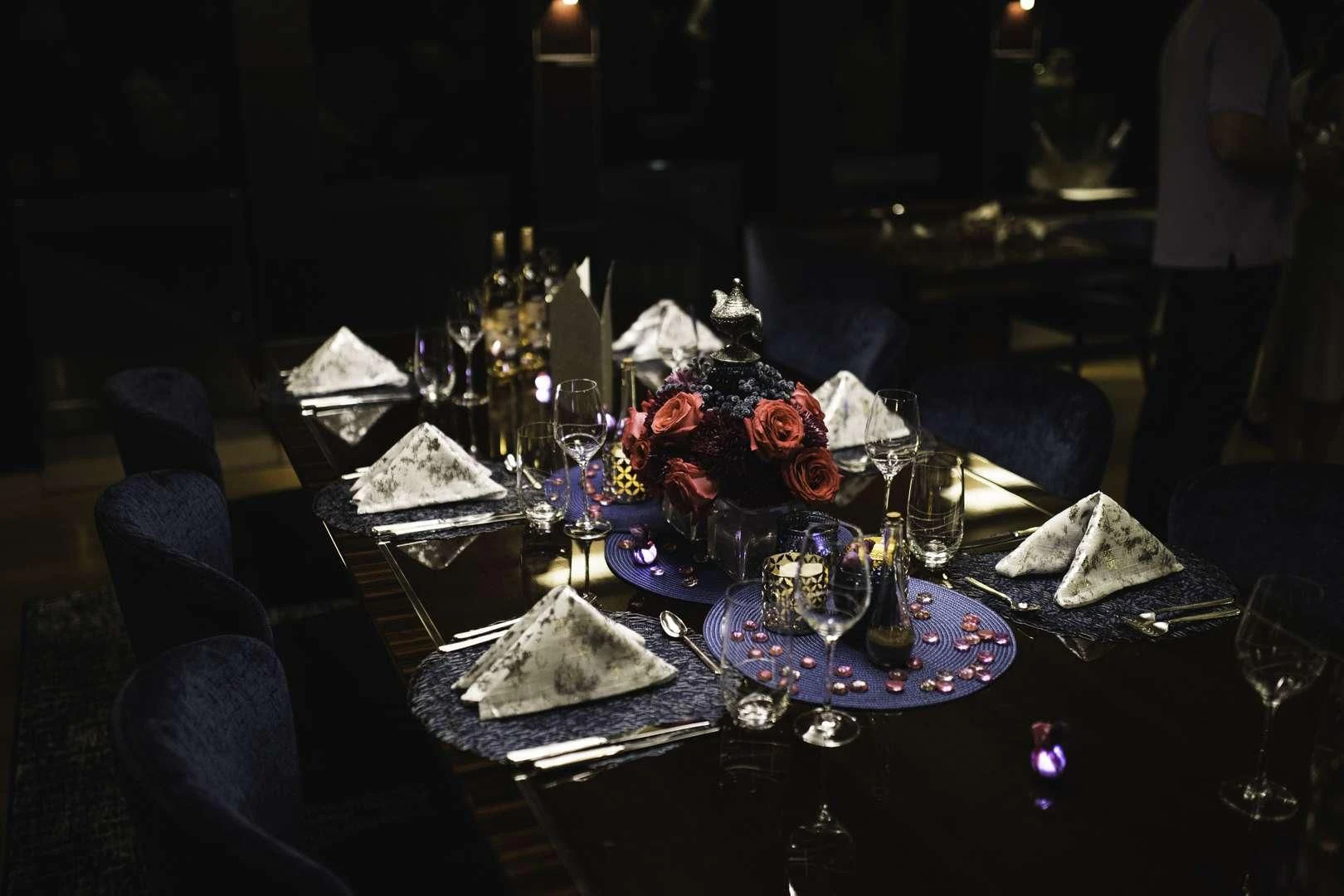 a table with a cake and wine glasses on it aboard AQUANOVA Yacht for Sale