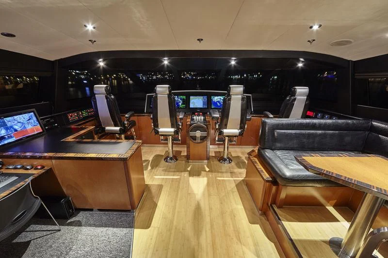 a room with a table and chairs aboard AQUANOVA Yacht for Sale