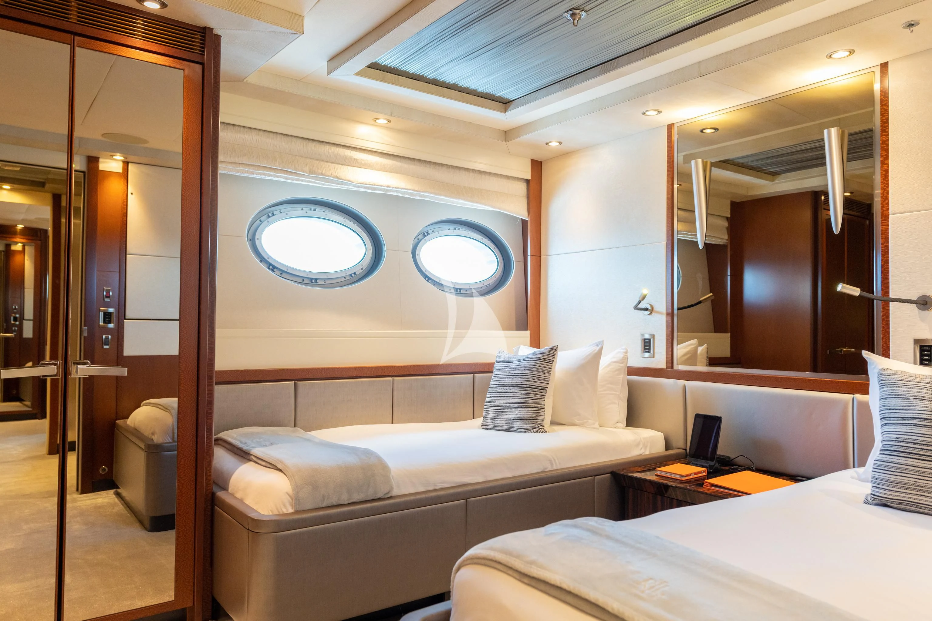 a room with a bed and a desk aboard AQUANOVA Yacht for Sale