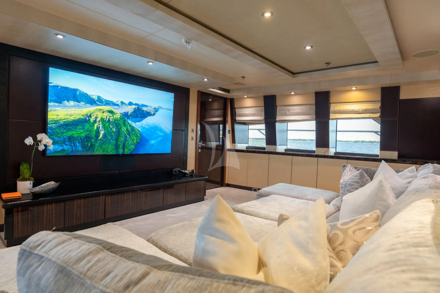 a large television in a room aboard AQUANOVA Yacht for Sale