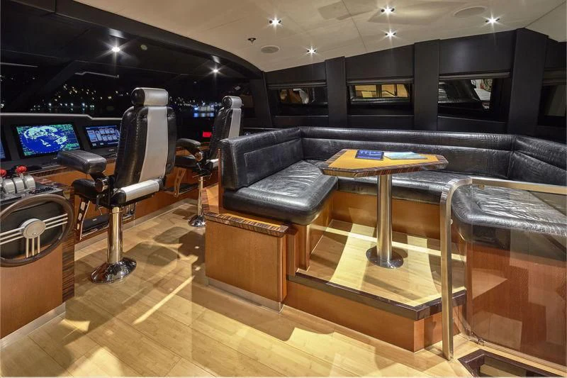 a room with a couch and a table aboard AQUANOVA Yacht for Sale