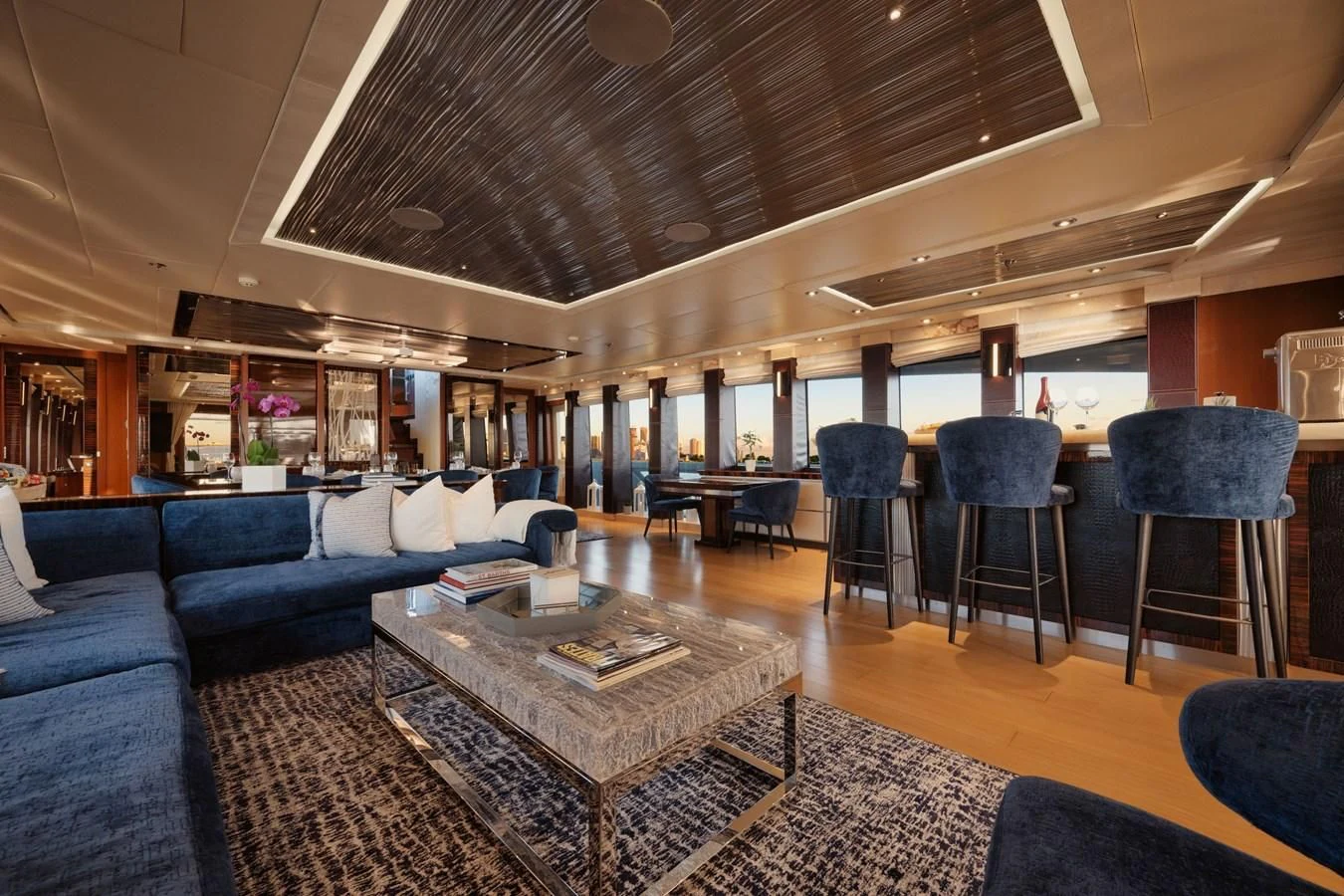 a living room with a table and chairs aboard AQUANOVA Yacht for Sale