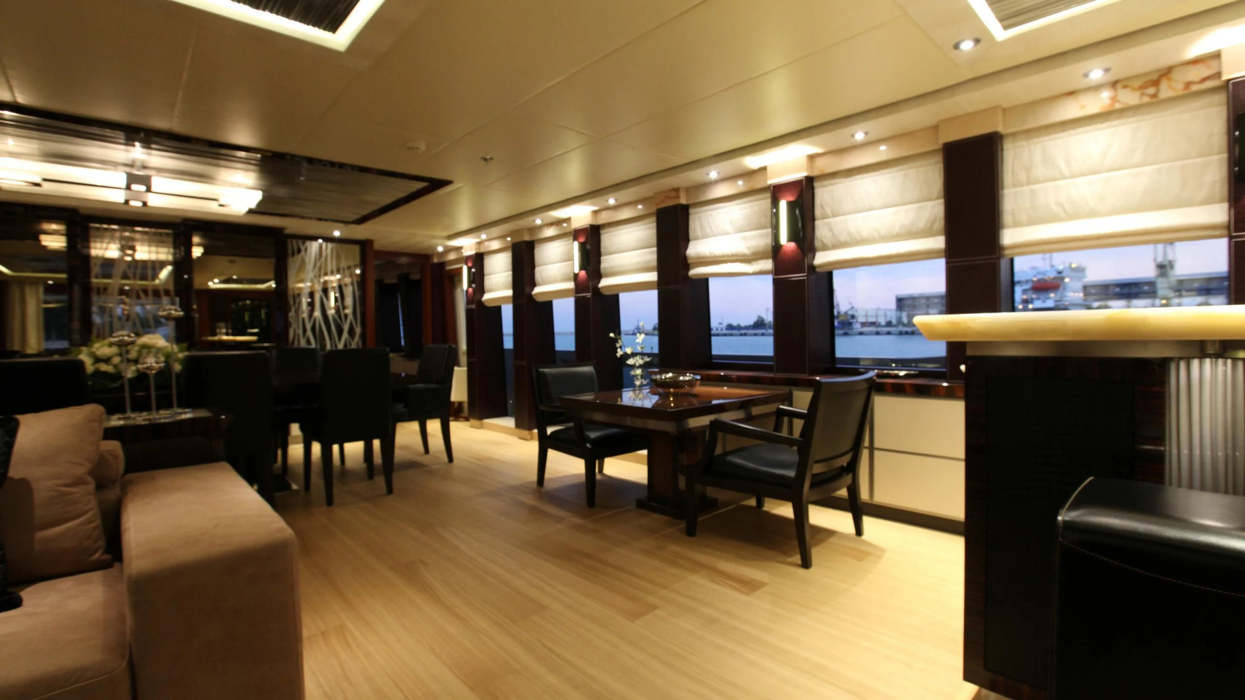 a room with a table and chairs aboard AQUANOVA Yacht for Sale