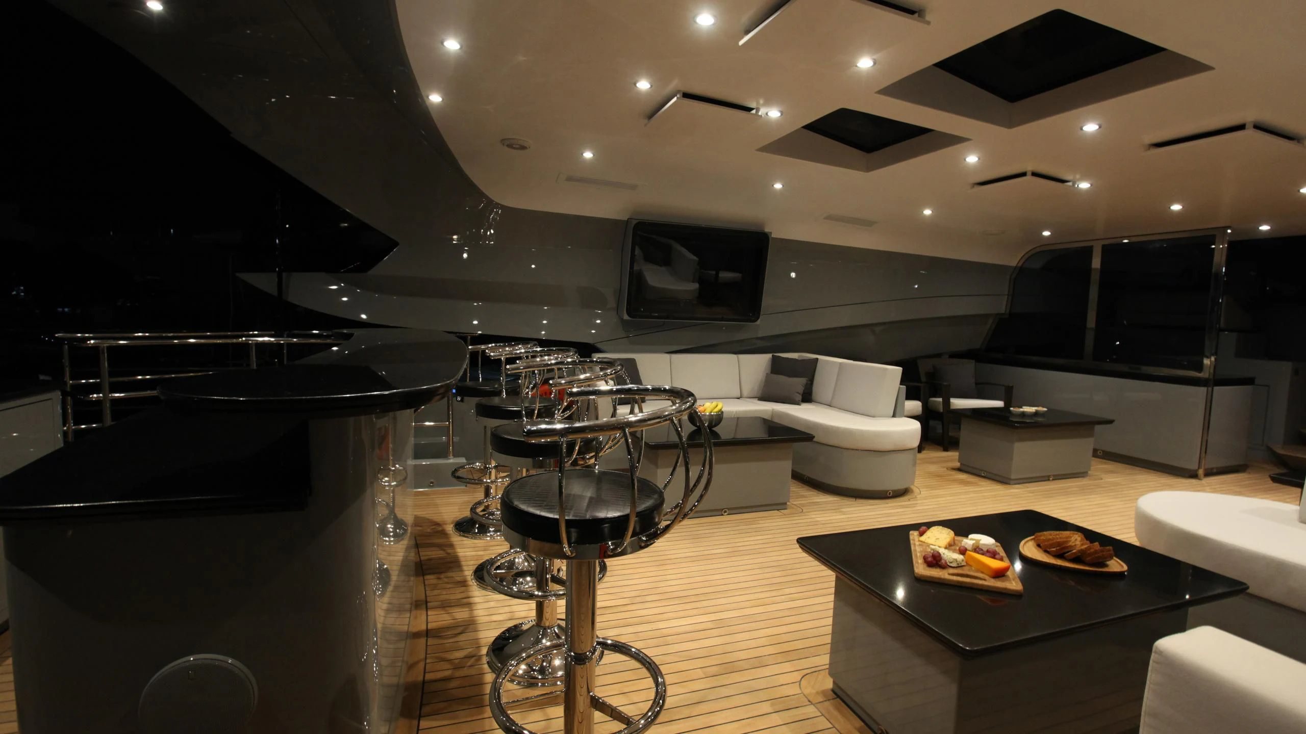 a room with a large table and chairs aboard AQUANOVA Yacht for Sale