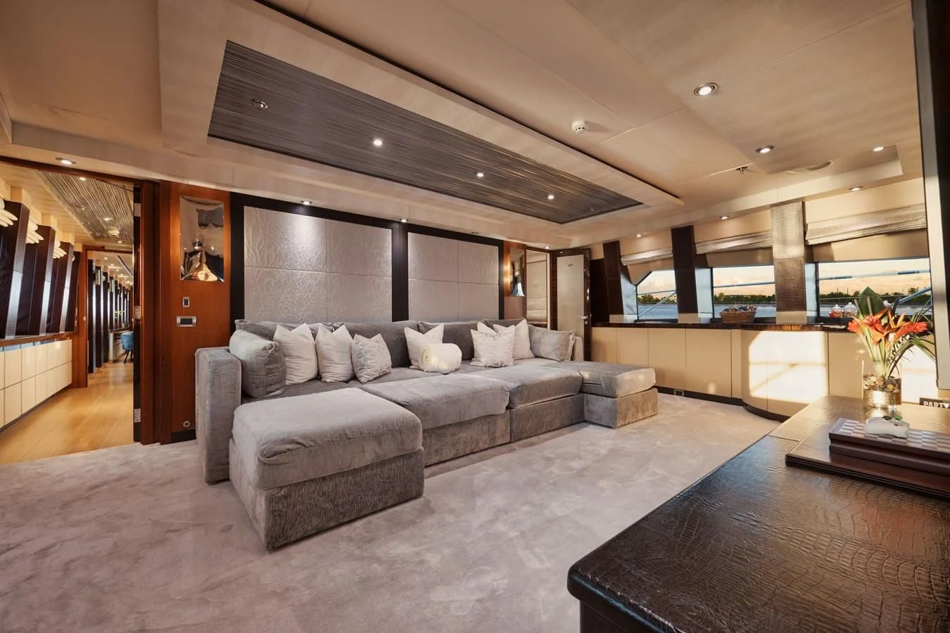 a living room with a large couch aboard AQUANOVA Yacht for Sale