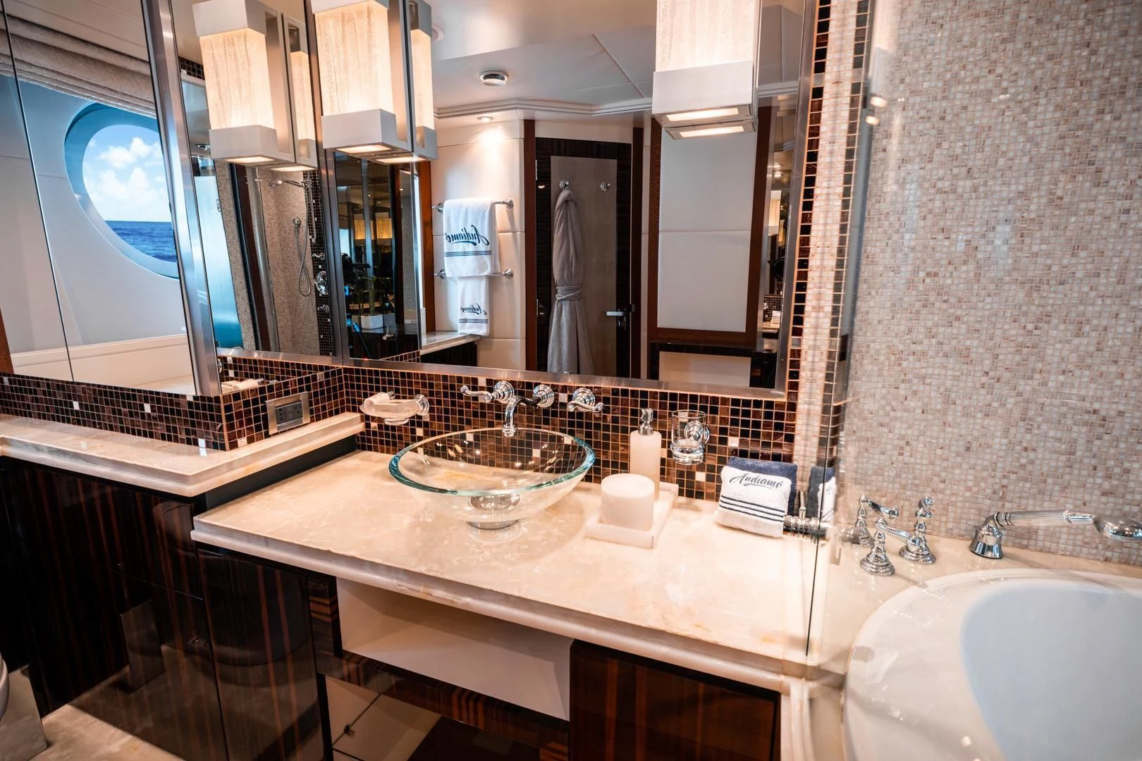 a bathroom with a large mirror aboard AQUANOVA Yacht for Sale
