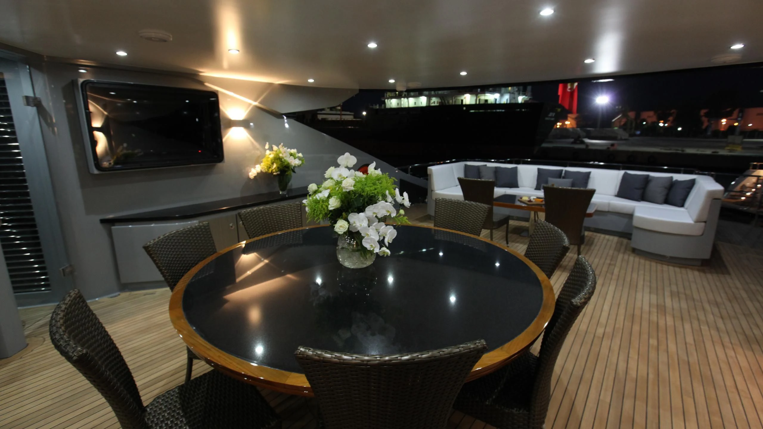 a room with a table and chairs aboard AQUANOVA Yacht for Sale