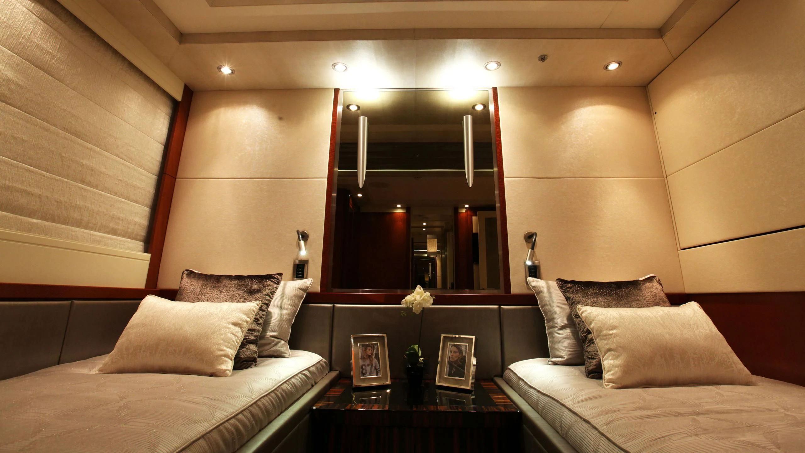 a room with a bed and a mirror aboard AQUANOVA Yacht for Sale