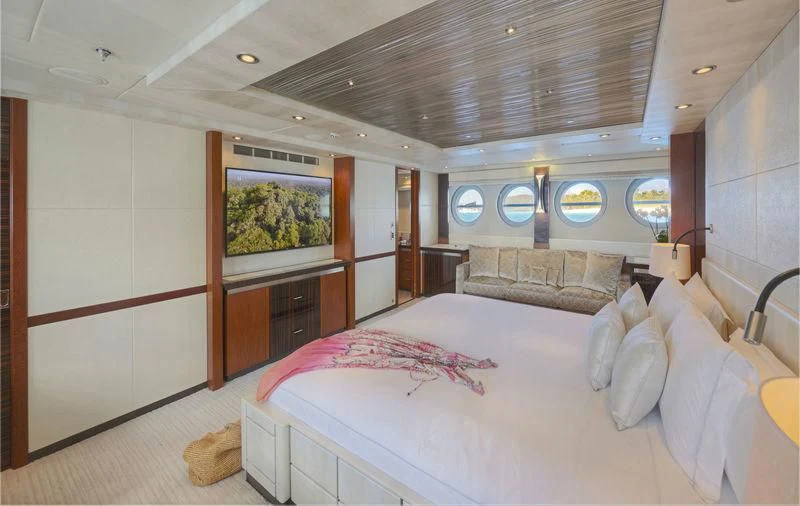 a room with a bed and a window aboard AQUANOVA Yacht for Sale