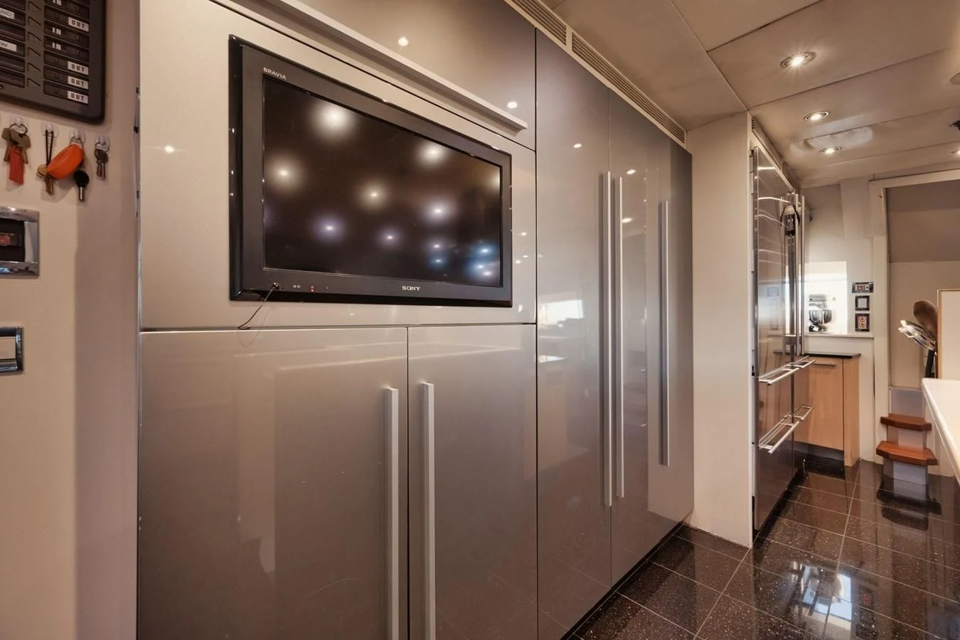 a large silver refrigerator aboard AQUANOVA Yacht for Sale