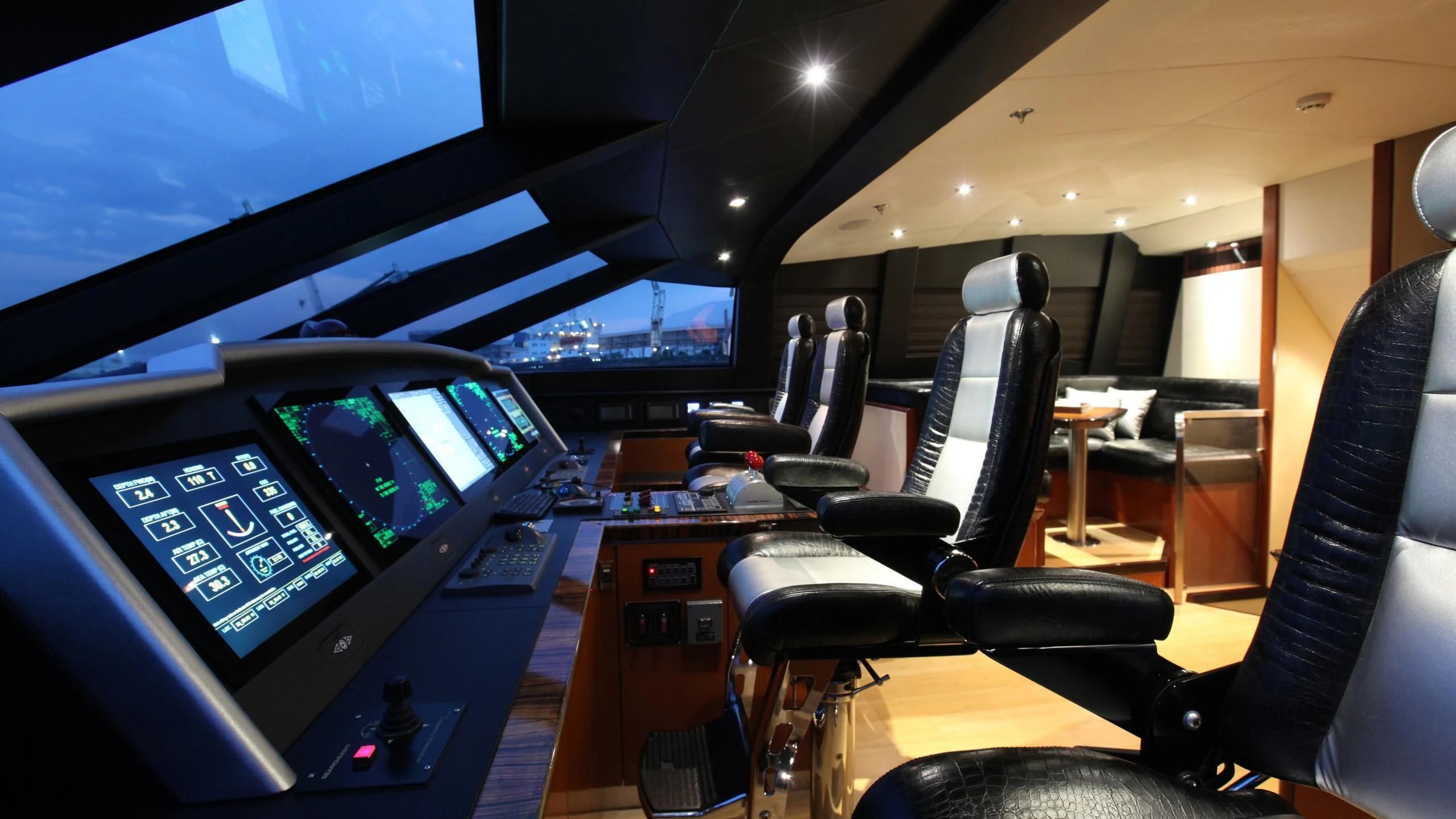 a room with computers and chairs aboard AQUANOVA Yacht for Sale