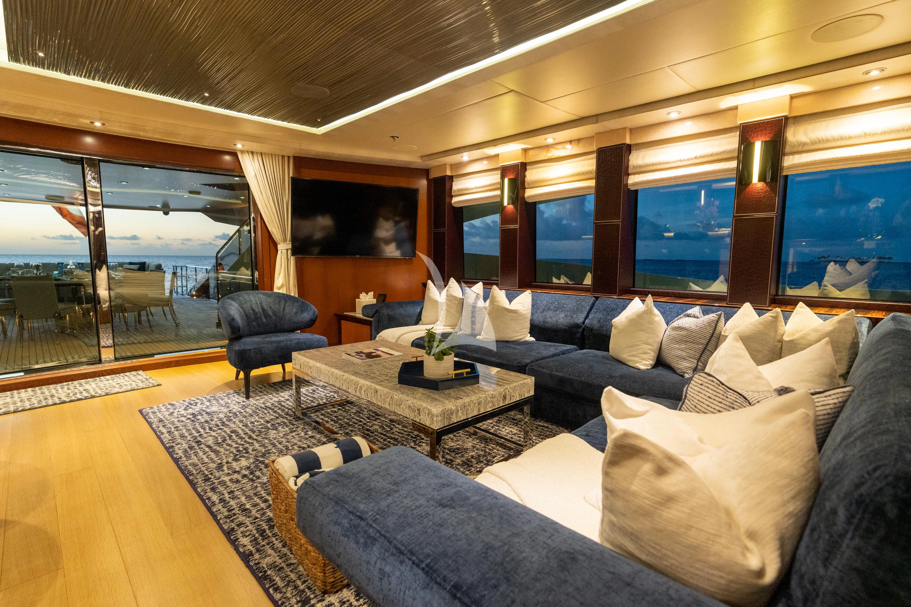 a living room with a large window aboard AQUANOVA Yacht for Sale