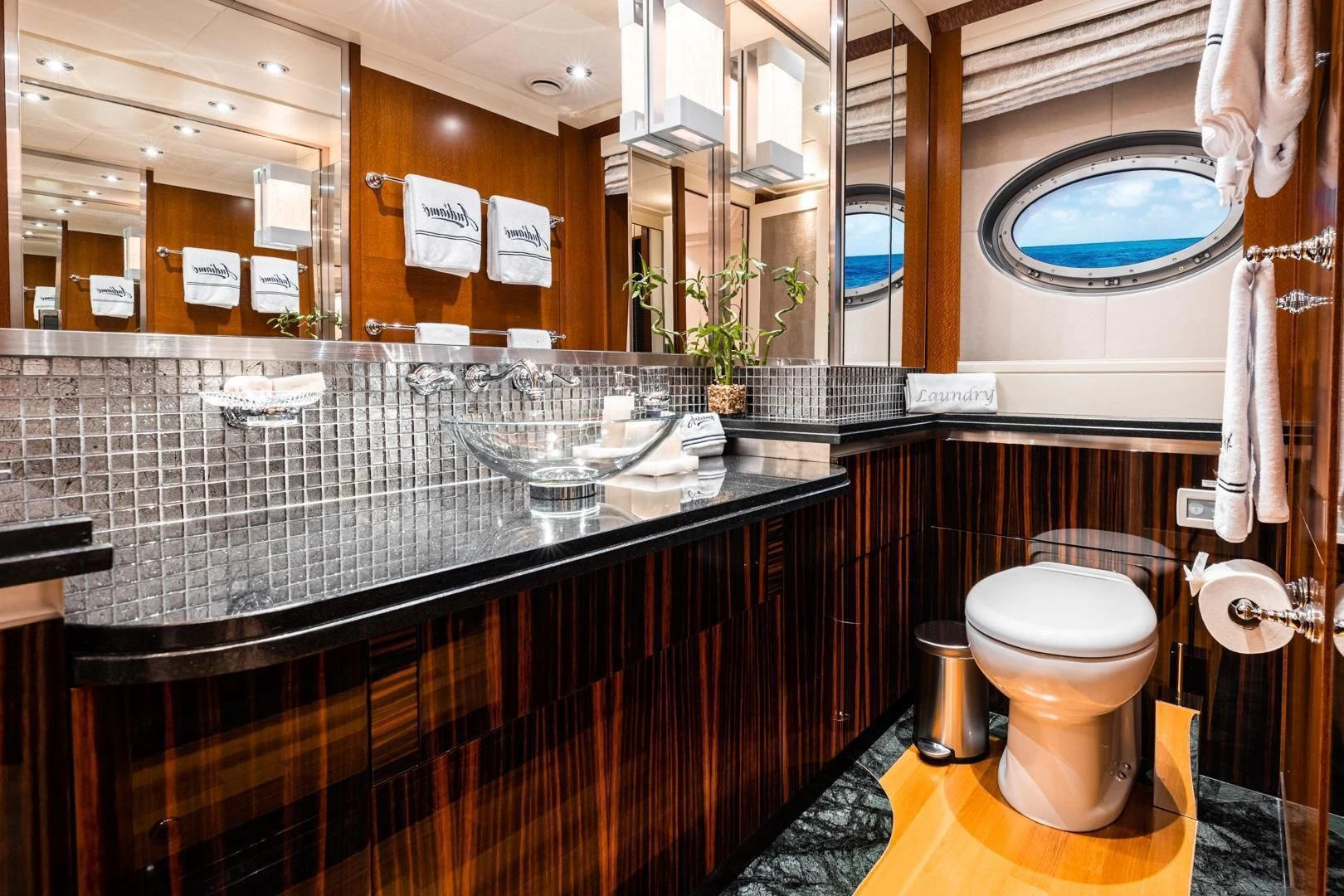 a bathroom with a large mirror aboard AQUANOVA Yacht for Sale