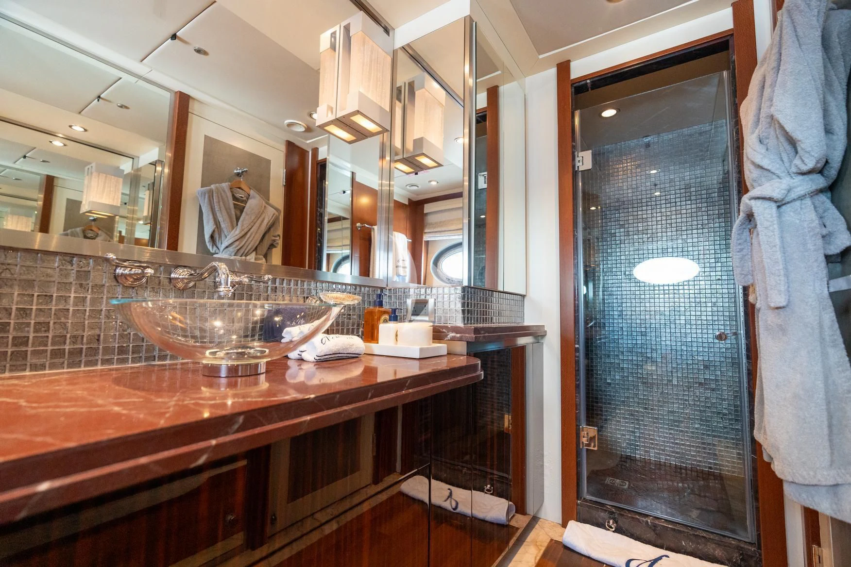 a bathroom with a sink and a mirror aboard AQUANOVA Yacht for Sale