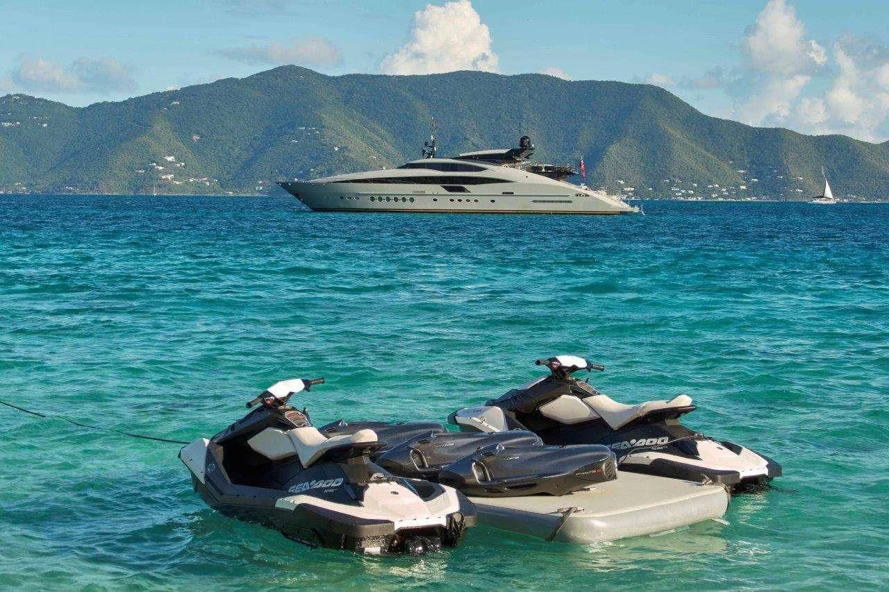 a boat in the water with a helicopter and a boat in the background aboard AQUANOVA Yacht for Sale