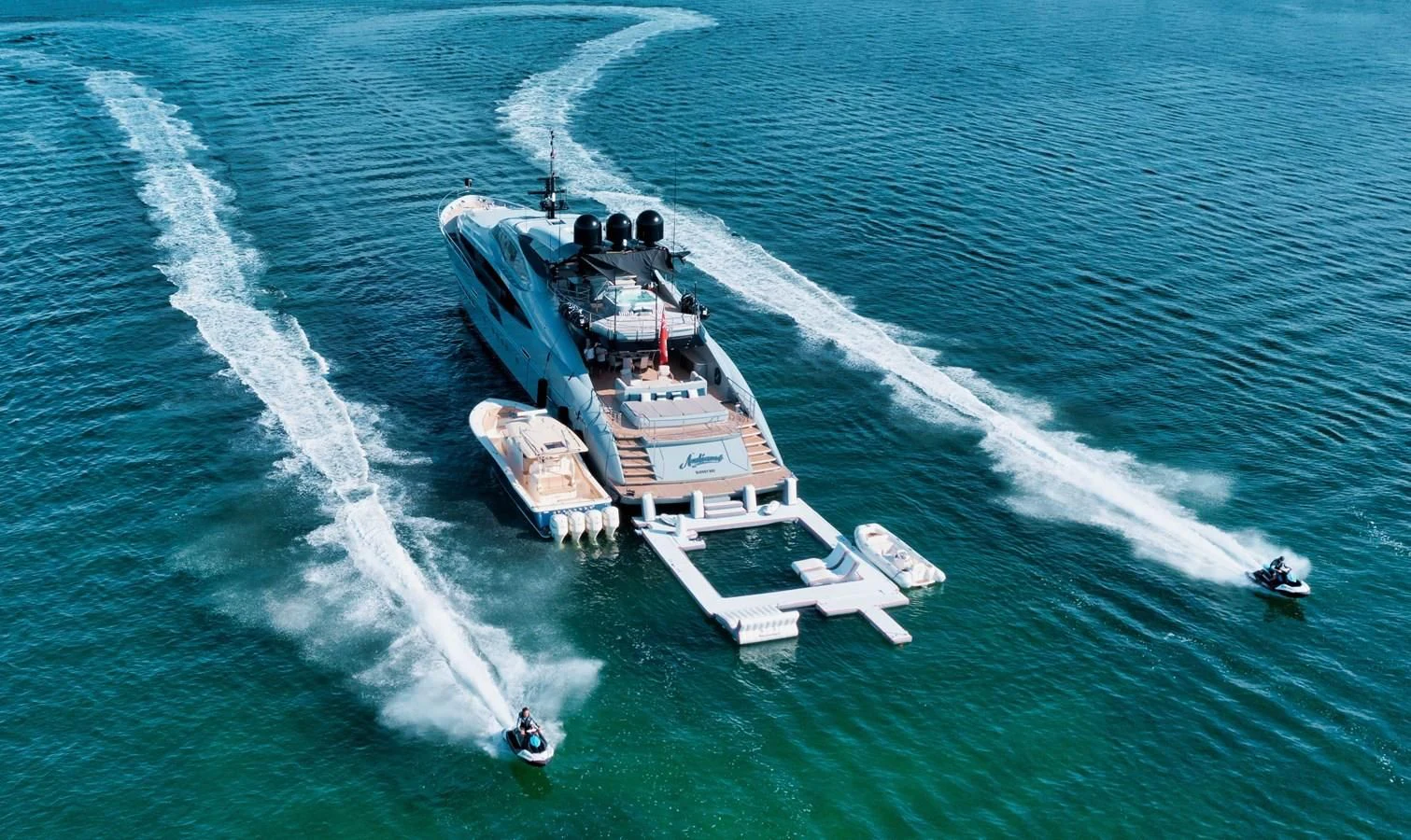 a helicopter flying over a ship aboard AQUANOVA Yacht for Sale