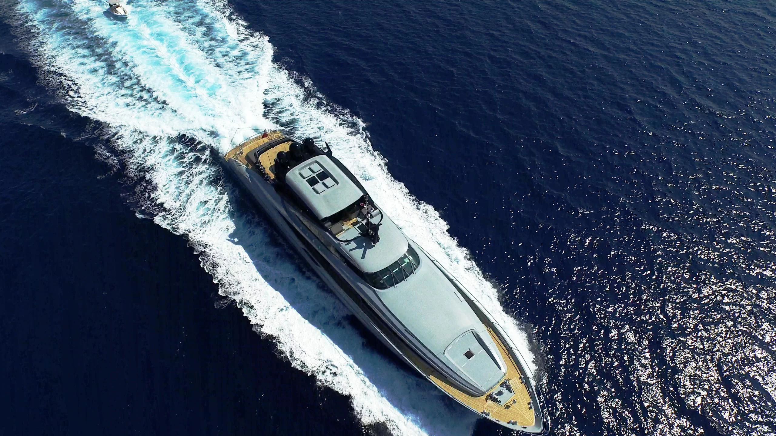 a helicopter flying over a beach aboard AQUANOVA Yacht for Sale