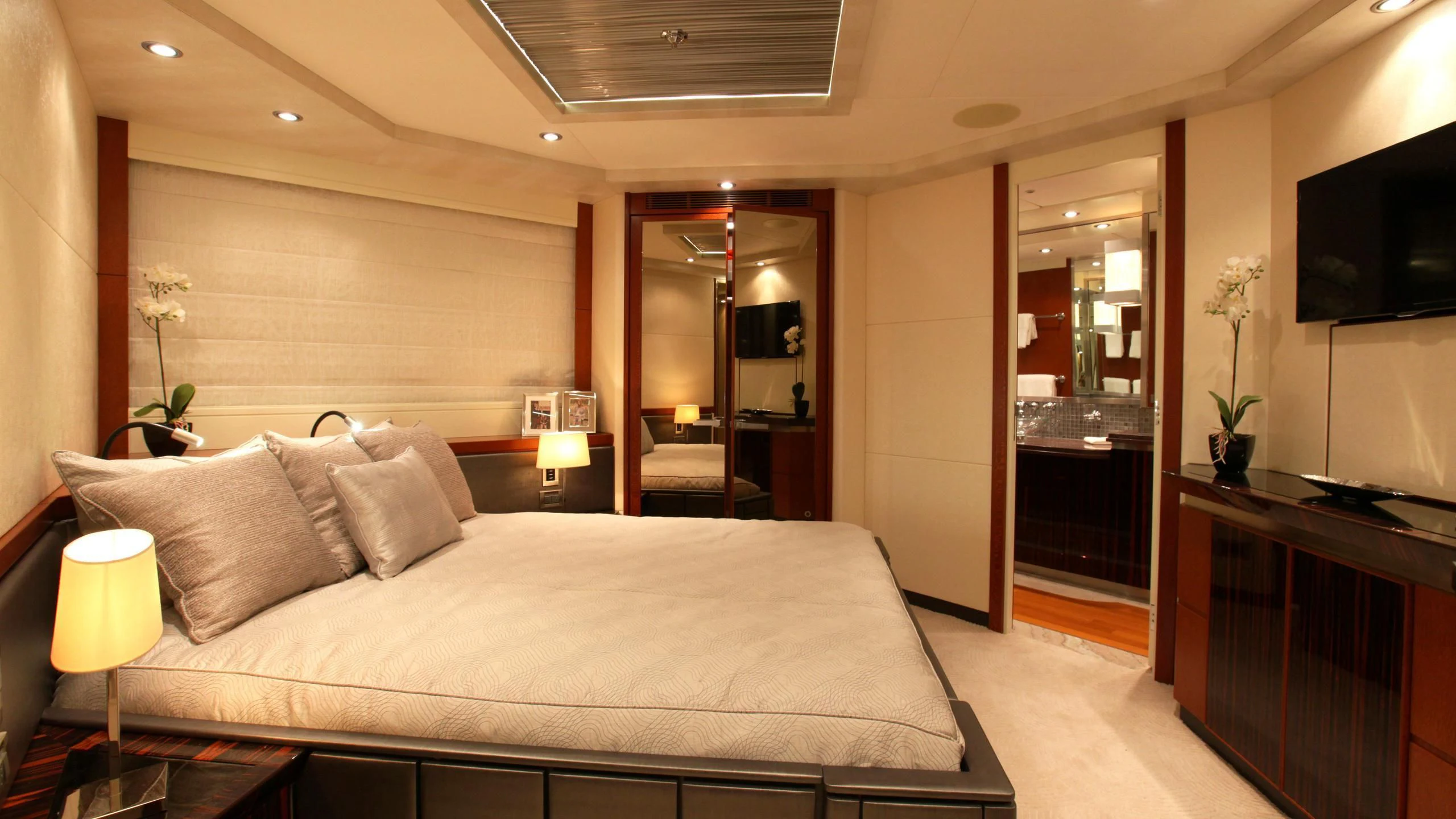 a large bed in a hotel room aboard AQUANOVA Yacht for Sale