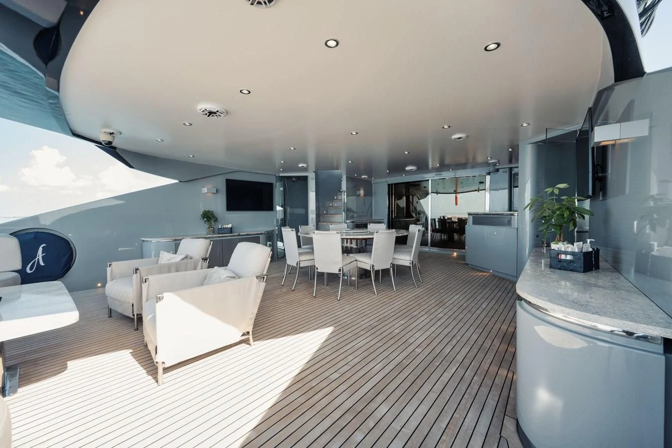 a room with a table chairs and a large window aboard AQUANOVA Yacht for Sale