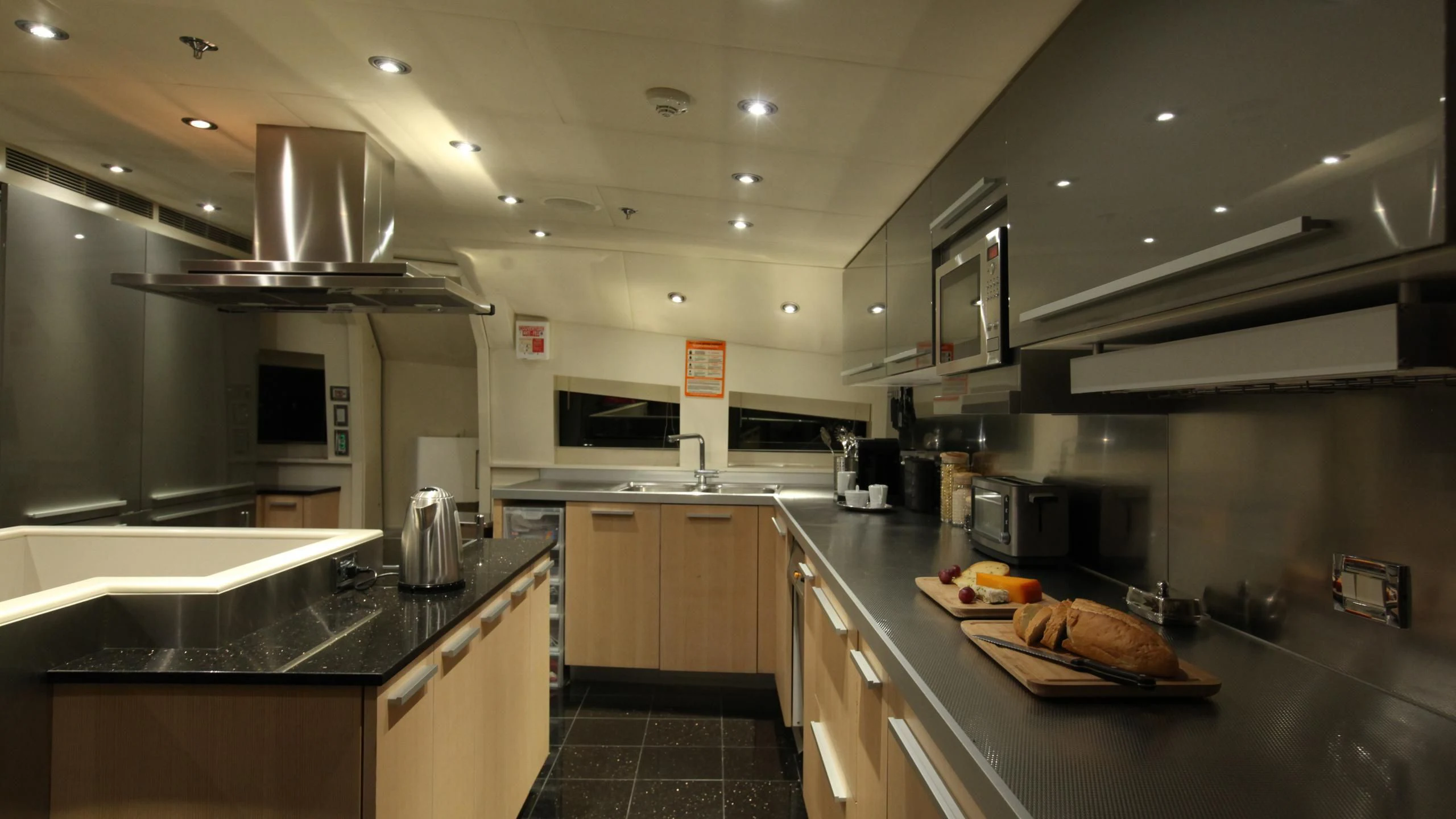 a kitchen with a large island aboard AQUANOVA Yacht for Sale