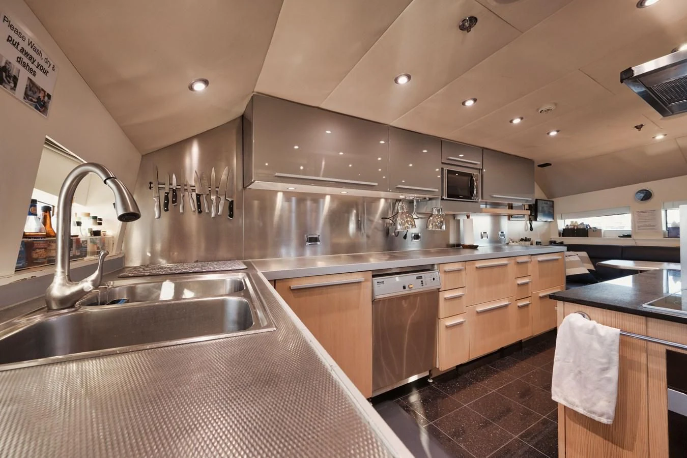a kitchen with a large island aboard AQUANOVA Yacht for Sale