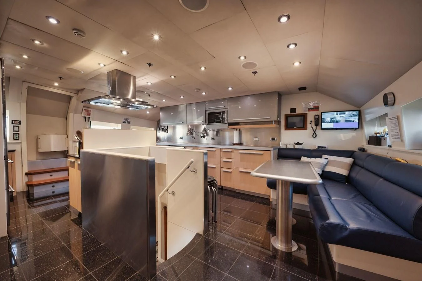 a kitchen with a bar and a bar aboard AQUANOVA Yacht for Sale