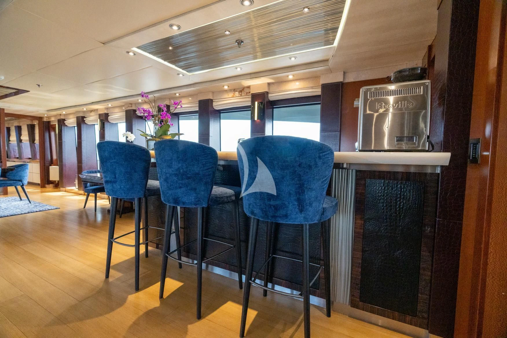 a kitchen with a table and chairs aboard AQUANOVA Yacht for Sale