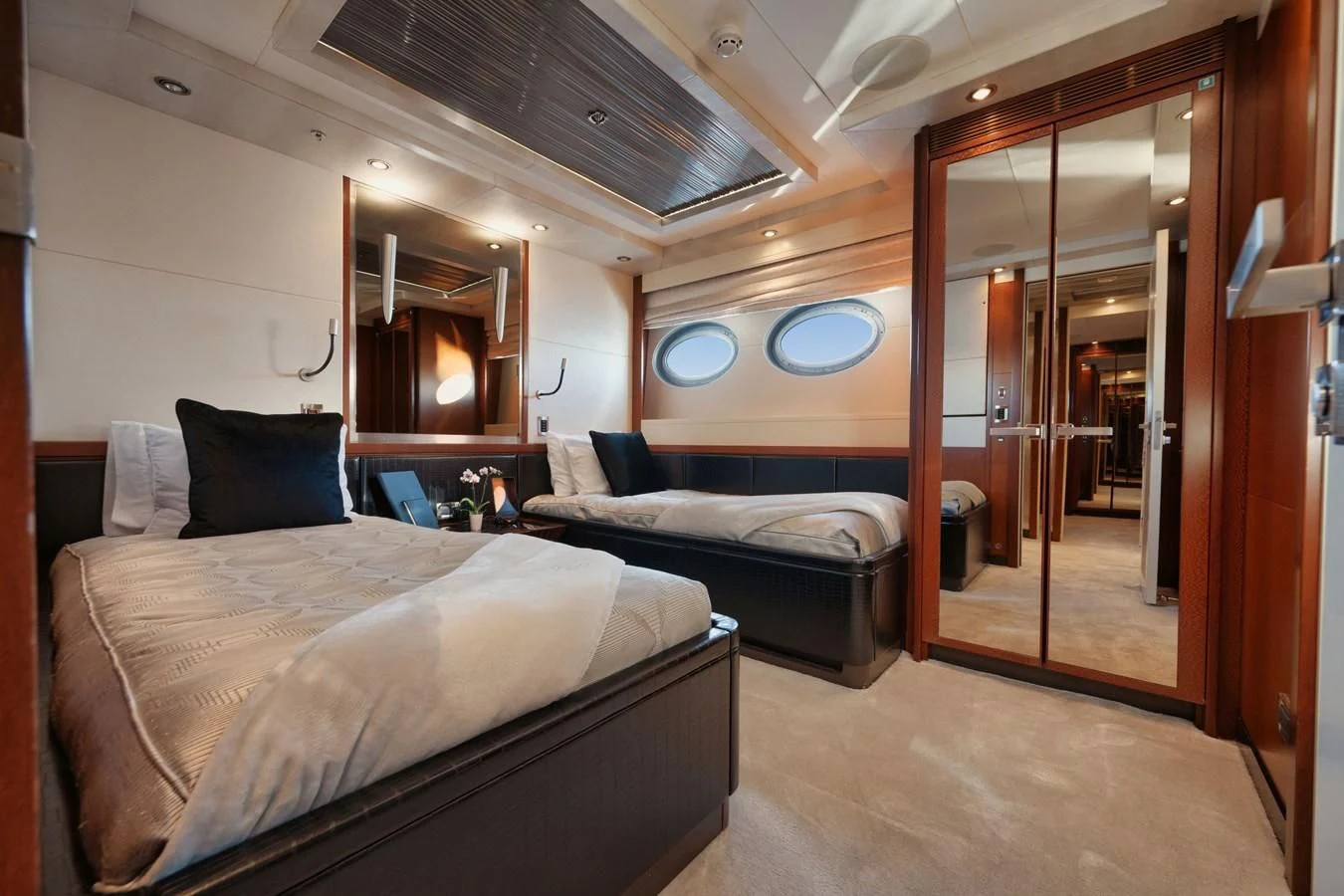 a room with a bed and a mirror aboard AQUANOVA Yacht for Sale