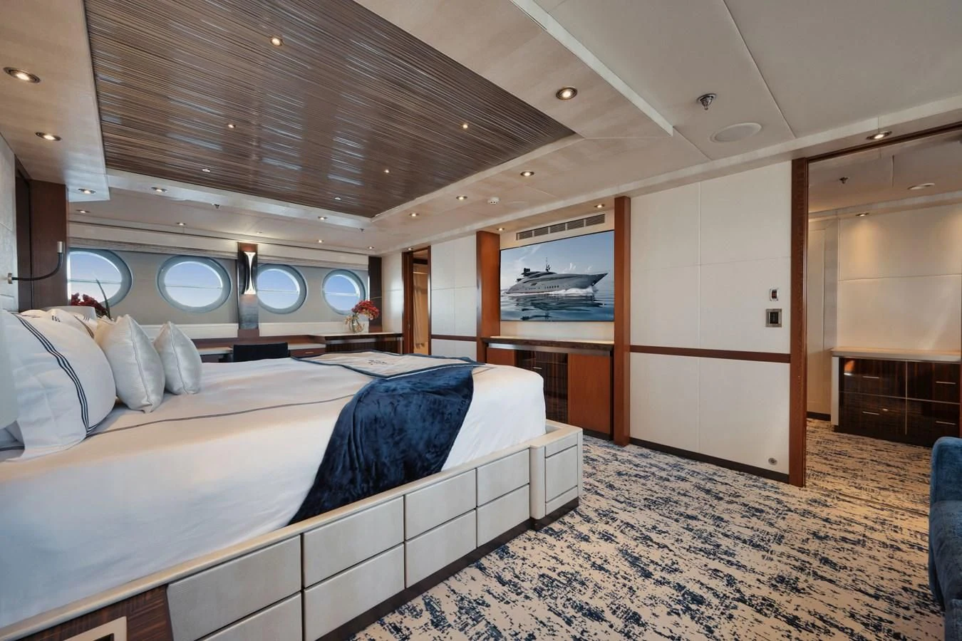 a room with a bed and a mirror aboard AQUANOVA Yacht for Sale