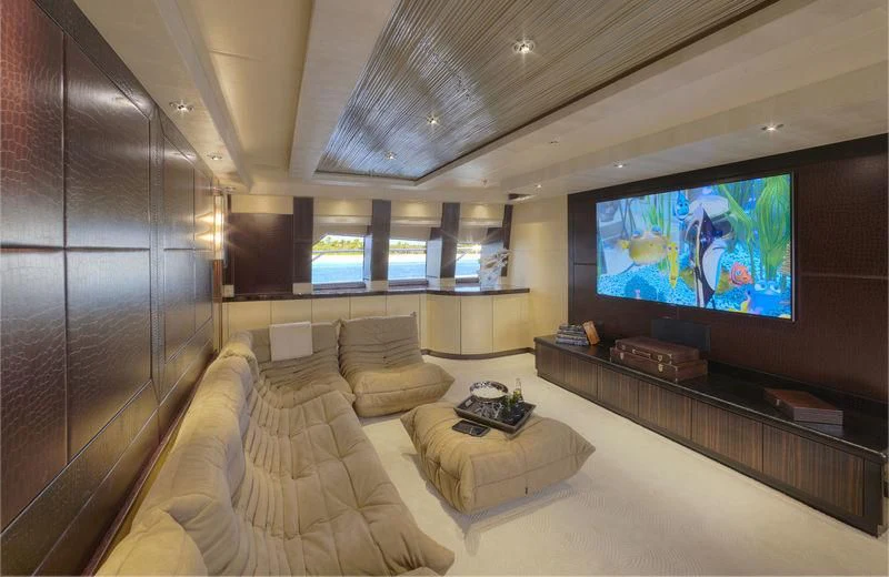 a large room with a large screen aboard AQUANOVA Yacht for Sale